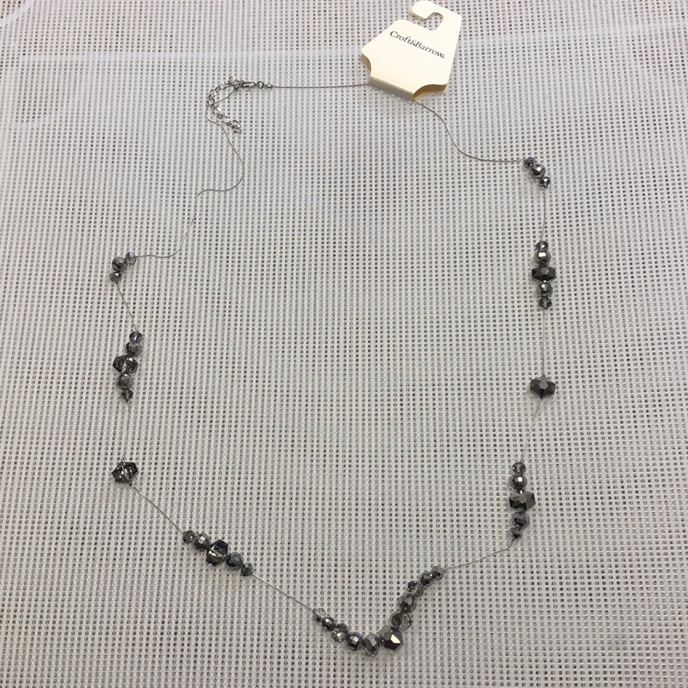 Long necklace with metallic beads